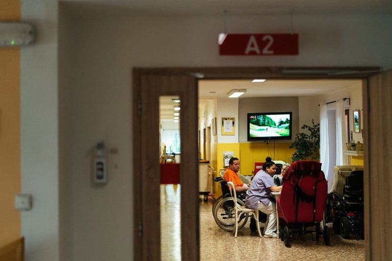 A caregiver with a resident in a care unit